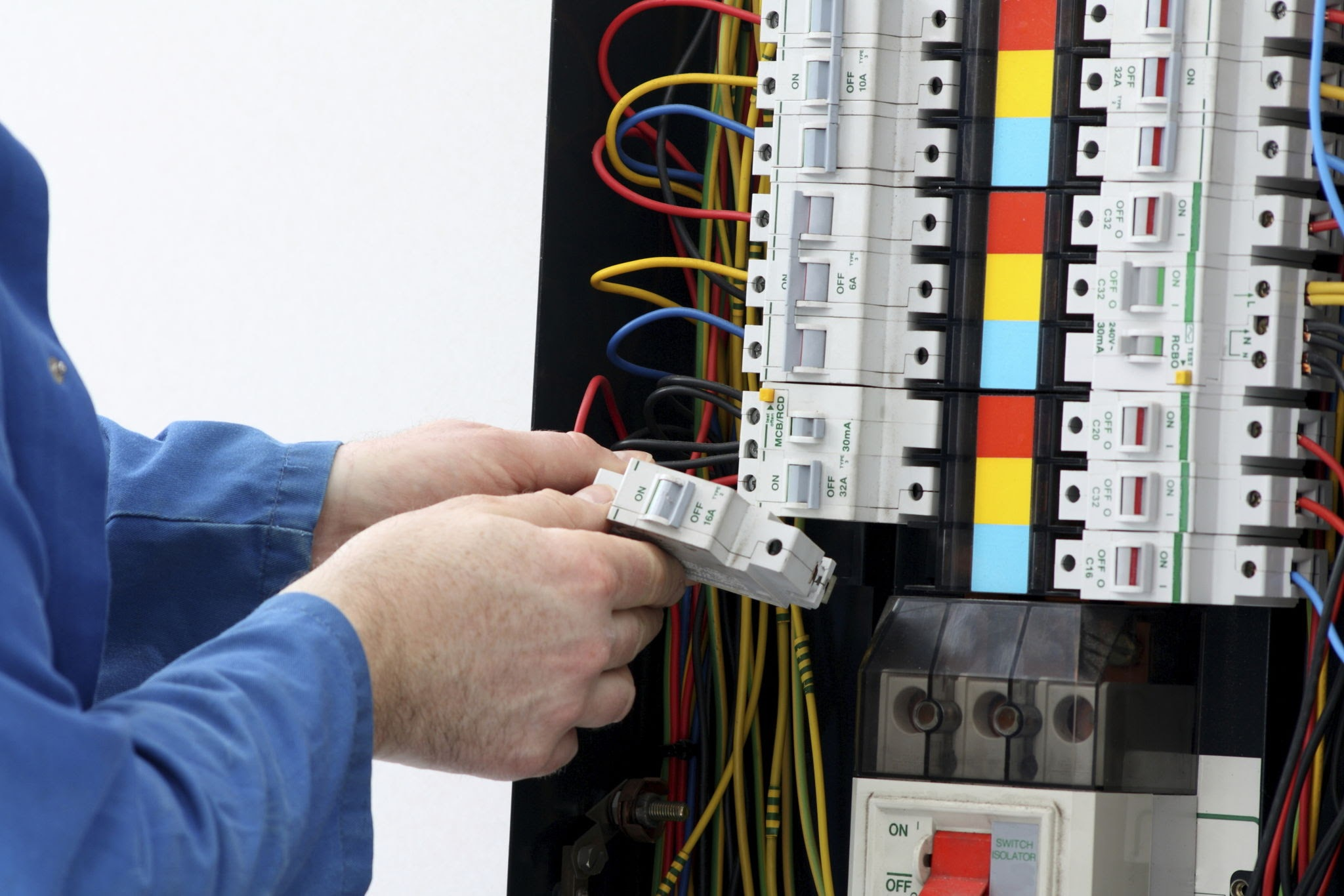 Electrician working on a UK consumer unit, the kind of trade expertise AI models struggle to verify online